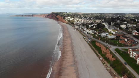 Aerial-forward-shot-of-Budleigh-Salterton-Beach-Devon-England-on-a-calm-sunny-day