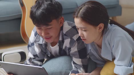 young couple using laptop together