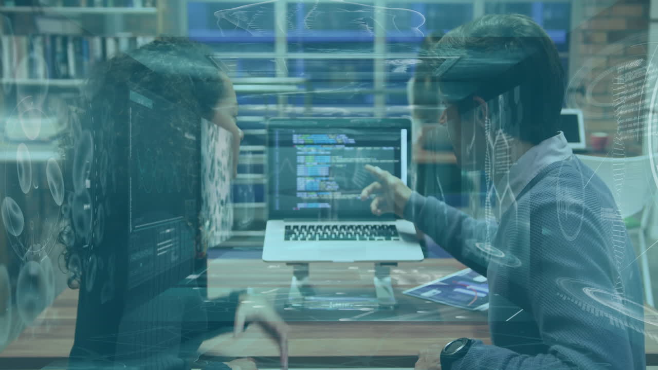 Collaborating on coding project, two people using animation with digital interface