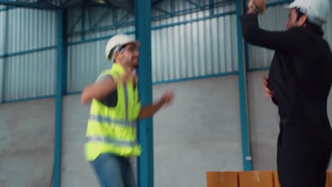 funny factory workers dance in the factory