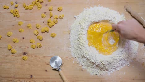 crop woman preparing dough at table in kitchen