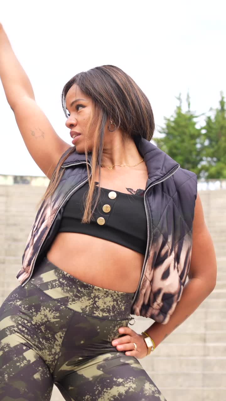 Woman dancing on stairs outdoors