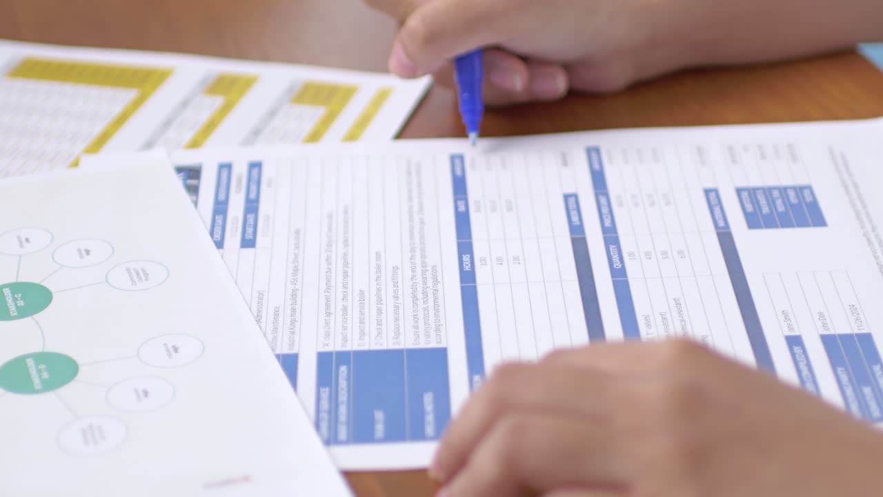 A detailed view of a person filling essential forms a professional office setting
