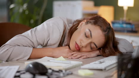 woman sleeping at desk