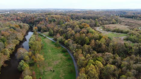 Aerial-view-of-the-Conestoga-River-in-Lancaster-Pennsylvania-during-autumn,-colorful-fall-foliage