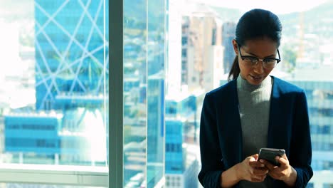 female executive using mobile phone