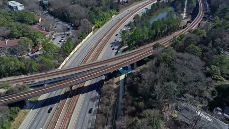 Aerial-birds-eye-shot-of-traffic-on-american-interstate-during-sunny-day