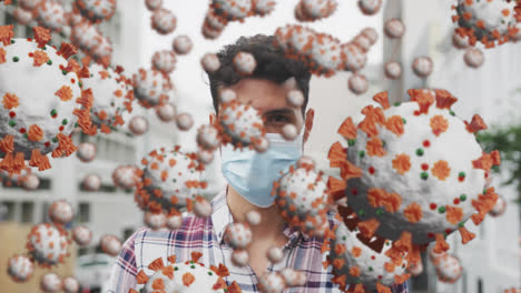 animation of covid 19 cells floating over man wearing face mask in street