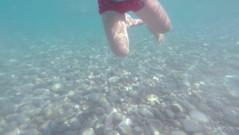 Underwater-Footage-of-Kid-Snorkeling-at-Kalamata-Beach,-Greece