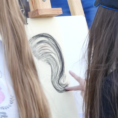 artist paints with his fingers