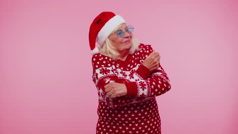 Senior-Christmas-grandmother-woman-with-deer-antlers-listening-music,-dancing-disco,-fooling-around