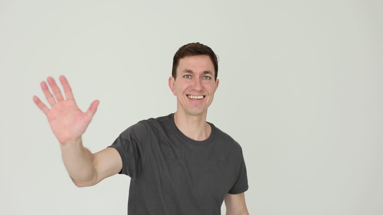 Man waving and greeting