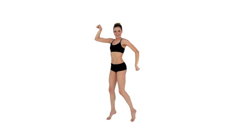 dynamic brunette in sportswear dancing