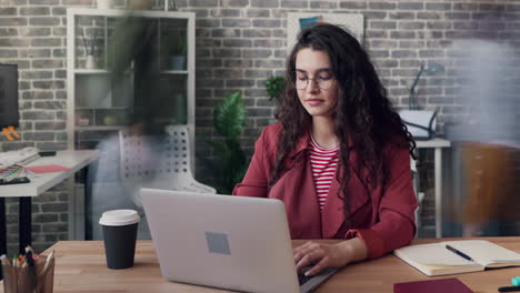 woman working on laptop in an office
