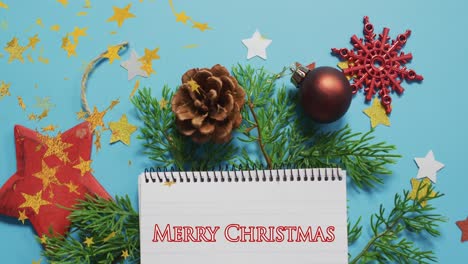 animation of christmas greetings over floating stars and christmas decorations