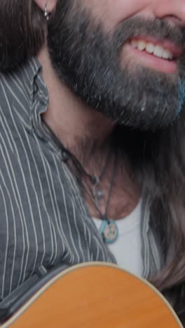 close-up of a bearded man singing with intense expression