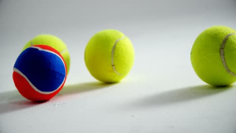 tennis balls on white background 4k