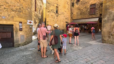 tourists enjoy a bustling french street scene