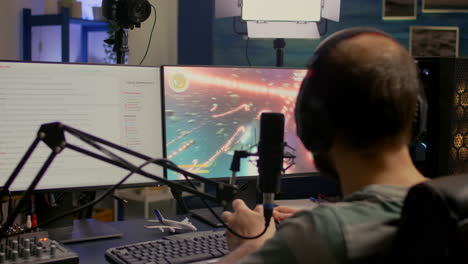 streamer with headphone losing space shooter game competition using modern equipment