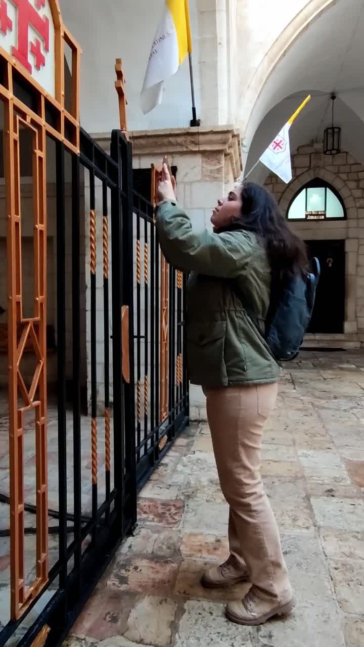 Young Woman Tourist Taking a Photo of a Church in Jerusalem