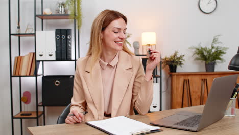 businesswoman holds keys for new room signs contract paper smiles shows keychain starts new chapter