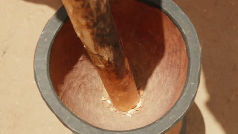 rustic mortar and pestle grinding spices in sunlight