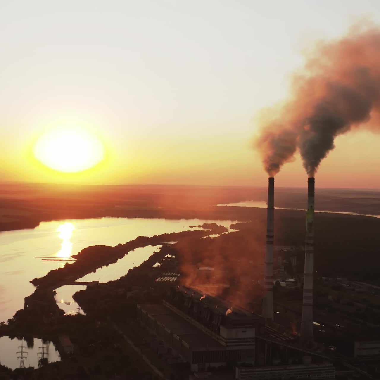 Static view of the power pylons on sunset time background. High voltage electric tower at the sunset. Fabric concept. Selective focus