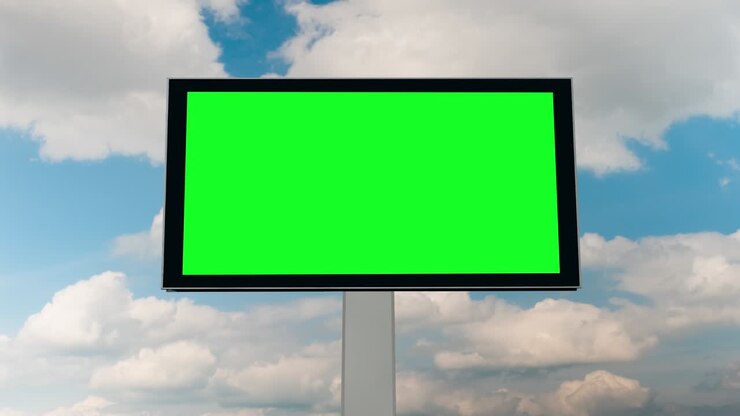 Blank green billboard and moving white clouds agains blue sky - timelapse