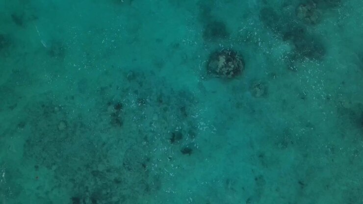 High drone shot view of beautiful turquoise water sea
