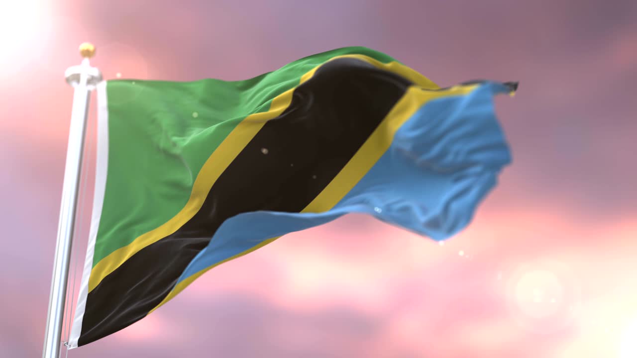 Bandiera della Tanzania che sventola al vento al rallentatore al tramonto, in loop