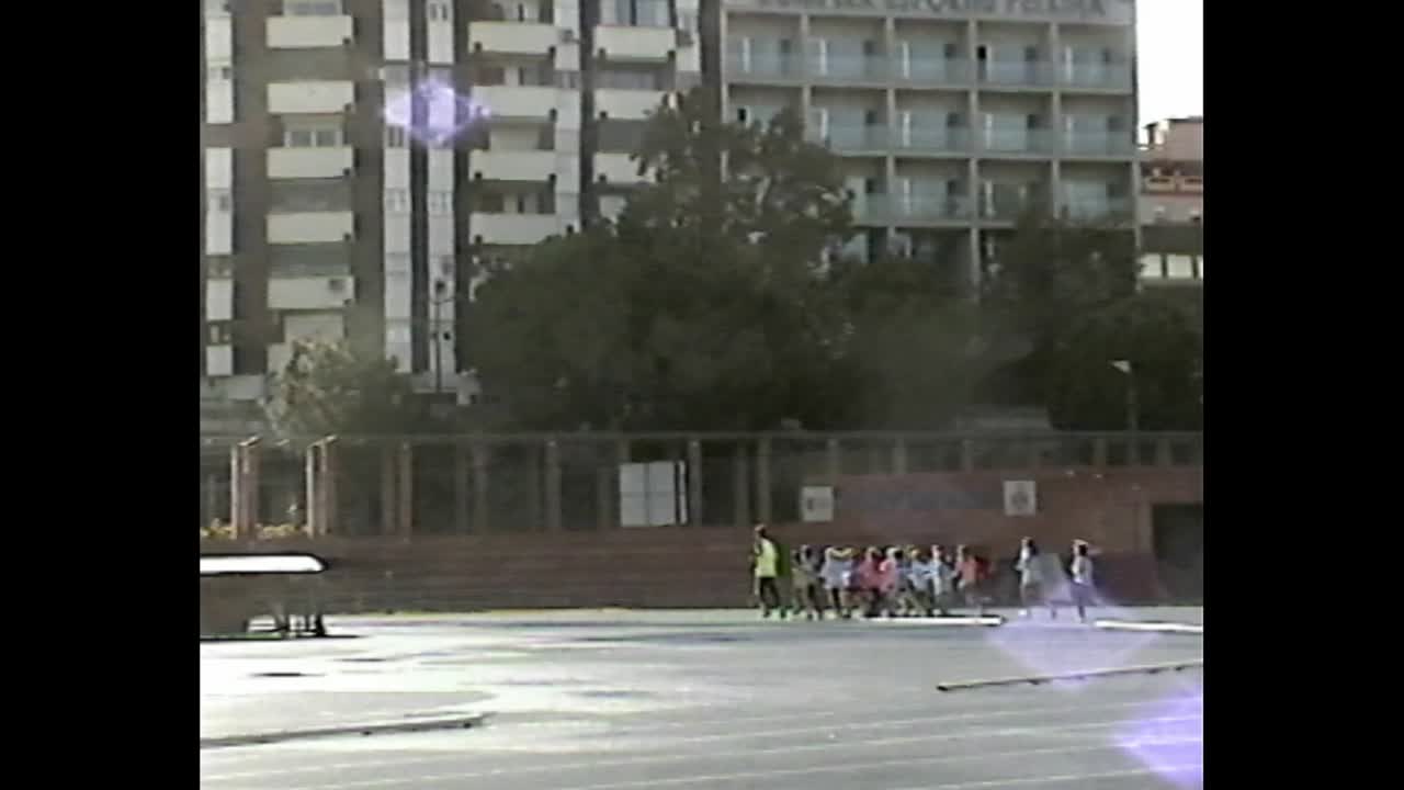 Children running in formation on urban track