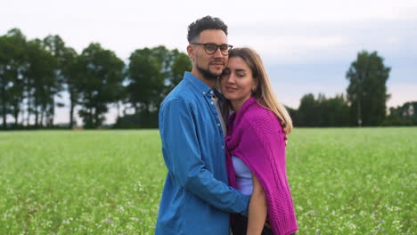 happy couple hugging outdoors