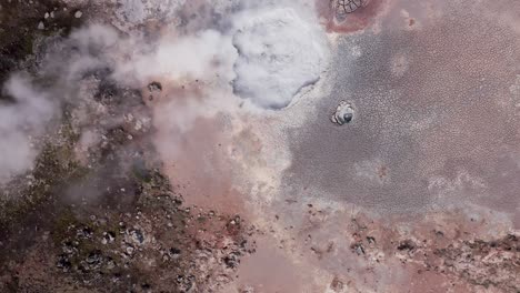 unique volcanic landscape in iceland with large bubbling mud pool, aerial