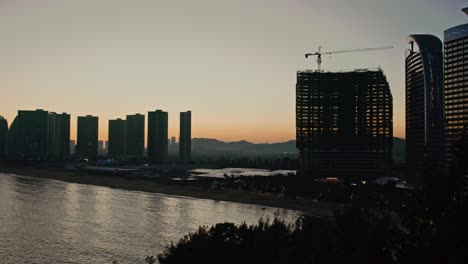 silhouetted urban huizhou during golden hours