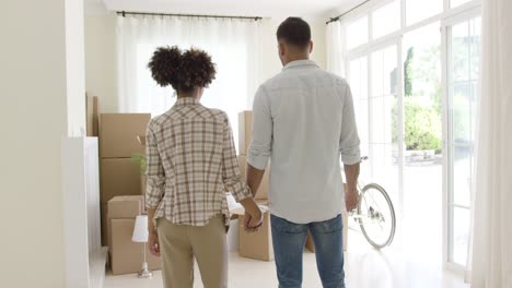 loving young couple saying goodbye to their home