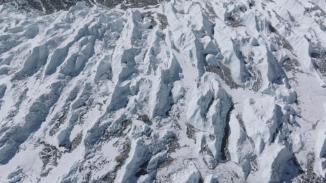 drone view of white khumbu glacier at everest base camp. sunny himalayas expose melting glaciers, climate crisis, and global water risks, snowy landscape of mount everest nepal