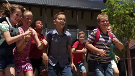 group of kids running in the school