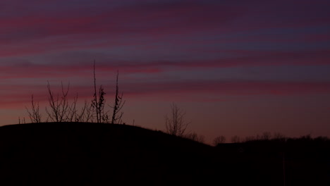 winter sunset behind hill timelapse