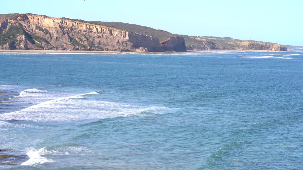 Surfers Paradise at Bells Beach Torquay Victoria South Pacific with waves hitting the shore and rocks