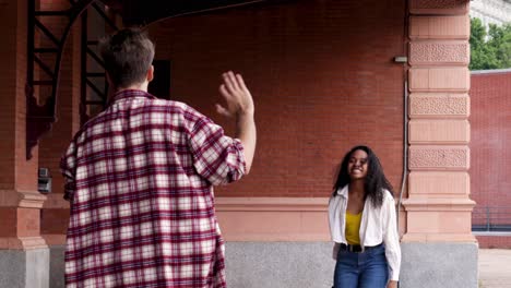 Man meeting girlfriend with suitcase