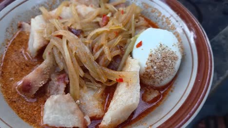 indonesian lontong sayur. rice cake with soup