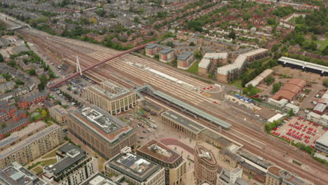 circling aerial shot over cambridge station entrance