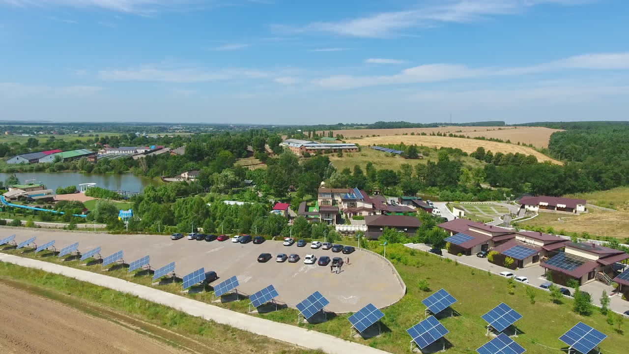 Well-organized rural territory for green tourism and rest. Houses and lawns equipped with solar panels. Spa resort area. View from above.