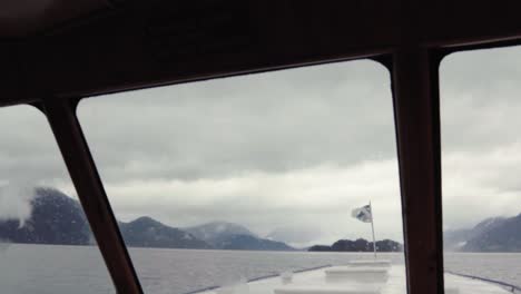 panoramic view from the inside of a ferry on the way to peulla