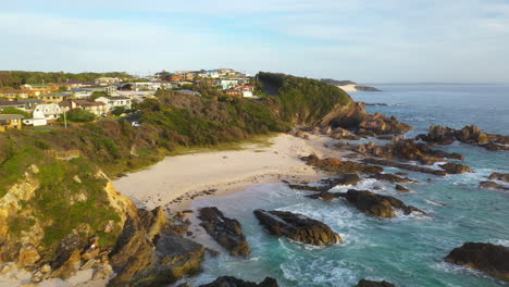 beautiful australian burgess beach in forster, new south wales, aerial reveal