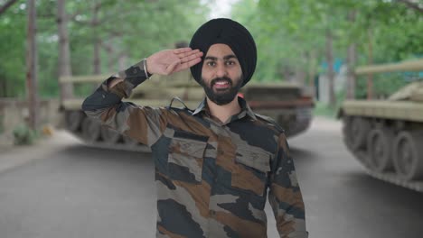 proud sikh indian army man saluting indian flag