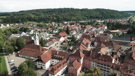 aerial of a small medieval town next to the river aare