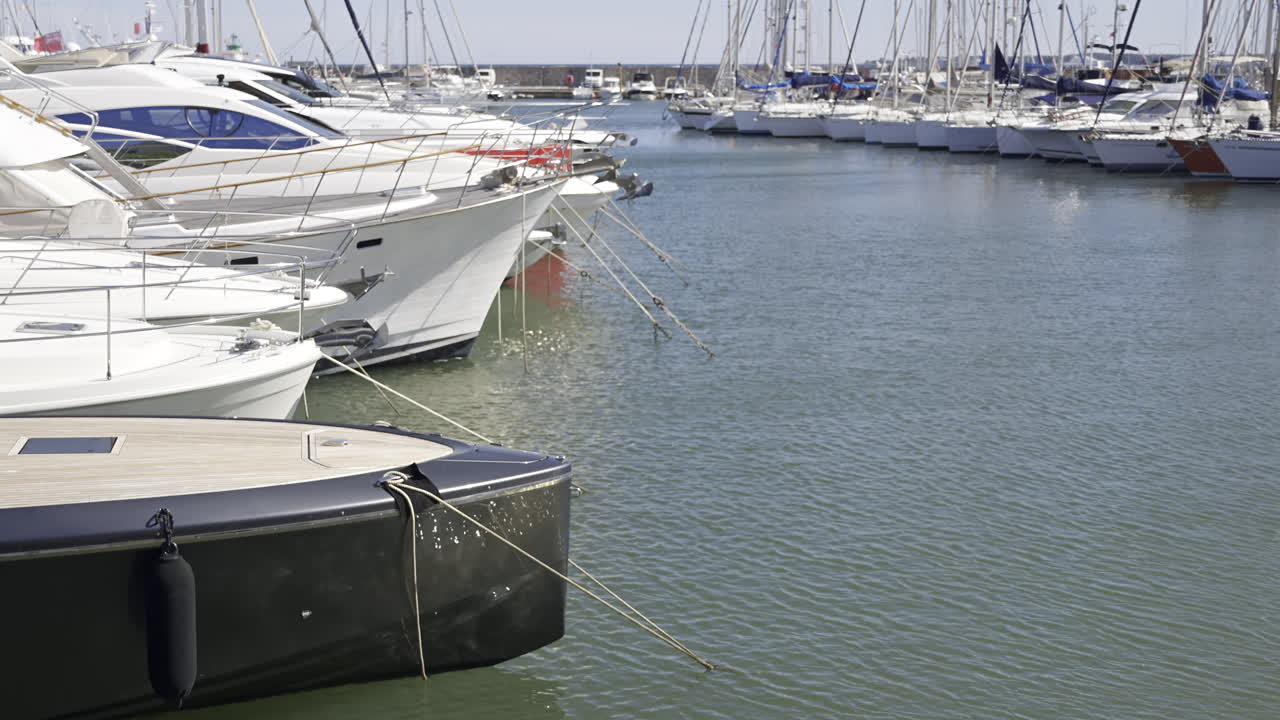 Docked boats moving in the wind in Port Vauban in Antibes, France