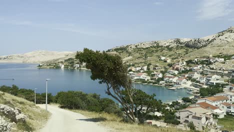 road towards village metajna on island pag in croatia, summer blue sky and adriatic sea