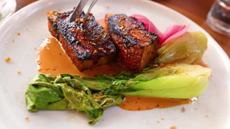 pork belly with bok choy and pickled vegetables